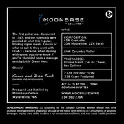 Moonbase Cellars wine label with text and contact information.